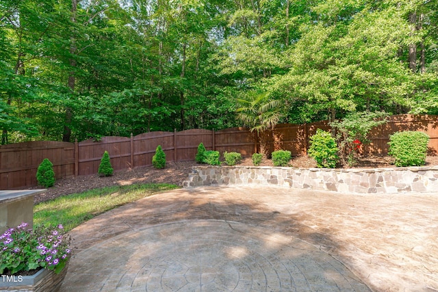 101 Quarryrock Rd, Holly Springs, NC 27540 - fenced backyard with a fire pit and a patio area