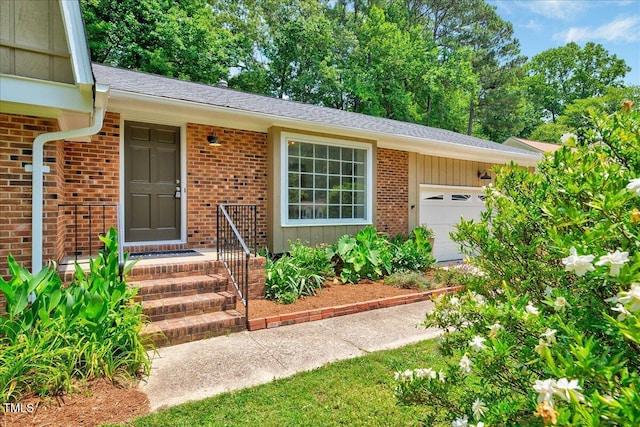 1209 Lochcarron Ln, Cary, NC 27511 - entrance to property featuring a garage and brick siding