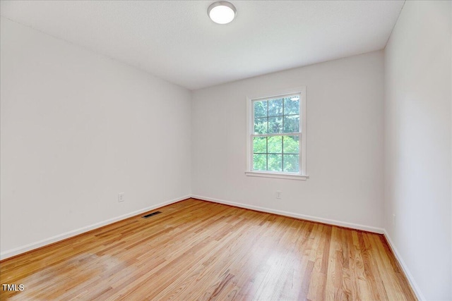 1209 Lochcarron Ln, Cary, NC 27511 - empty room with wood finished floors and baseboards