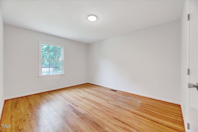1209 Lochcarron Ln, Cary, NC 27511 - spare room featuring wood finished floors and baseboards