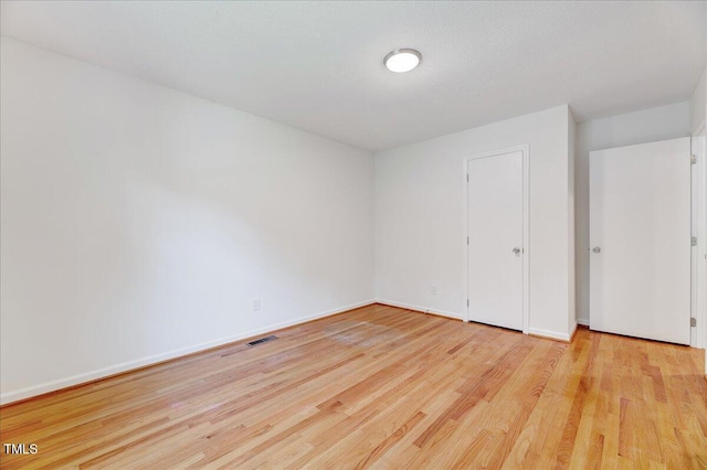 1209 Lochcarron Ln, Cary, NC 27511 - unfurnished bedroom featuring wood finished floors and baseboards