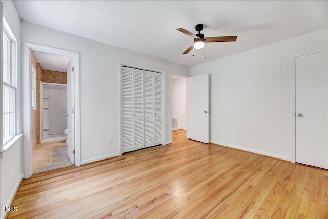 1209 Lochcarron Ln, Cary, NC 27511 - unfurnished bedroom with wood finished floors, ensuite bath, and baseboards