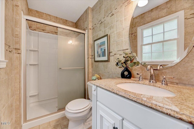 1209 Lochcarron Ln, Cary, NC 27511 - bathroom with tile walls, vanity, a stall shower, toilet, and tile patterned flooring