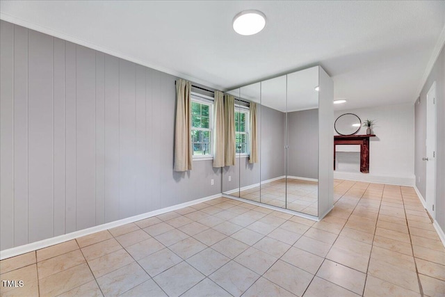 1209 Lochcarron Ln, Cary, NC 27511 - empty room featuring light tile patterned floors, baseboards, and ornamental molding