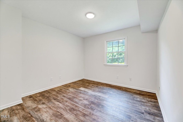 1209 Lochcarron Ln, Cary, NC 27511 - unfurnished room featuring wood finished floors and baseboards
