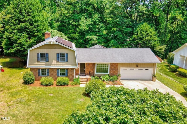 1209 Lochcarron Ln, Cary, NC 27511 - split level home with concrete driveway, an attached garage, a chimney, brick siding, and a shingled roof