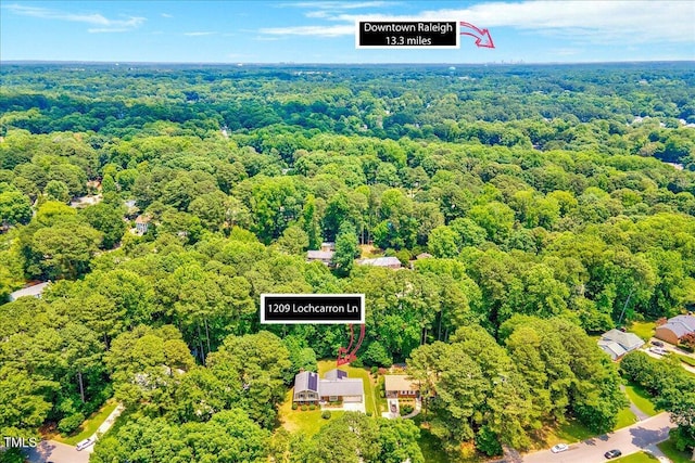 1209 Lochcarron Ln, Cary, NC 27511 - aerial view of property's location featuring a heavily wooded area