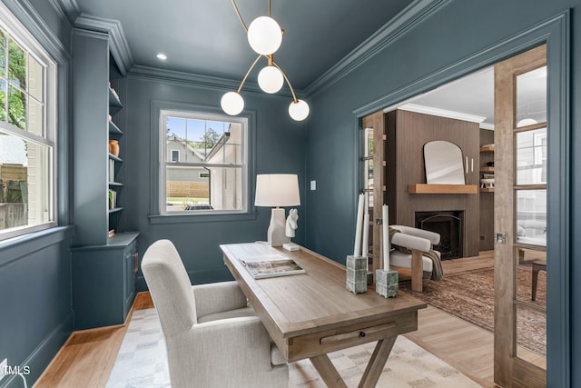 2100 Summit St, Durham, NC 27707 - home office with ornamental molding, light wood-style flooring, baseboards, and a fireplace
