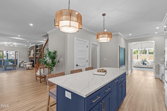 2100 Summit St, Durham, NC 27707 - kitchen with blue cabinets, open floor plan, light wood-type flooring, recessed lighting, and a kitchen island
