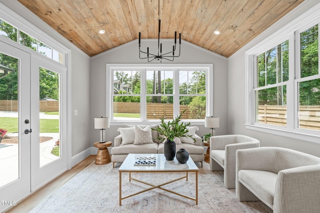 2100 Summit St, Durham, NC 27707 - living room featuring a chandelier, healthy amount of natural light, lofted ceiling, wood ceiling, and french doors