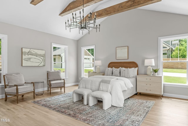2100 Summit St, Durham, NC 27707 - bedroom featuring beamed ceiling, baseboards, a chandelier, light wood finished floors, and high vaulted ceiling