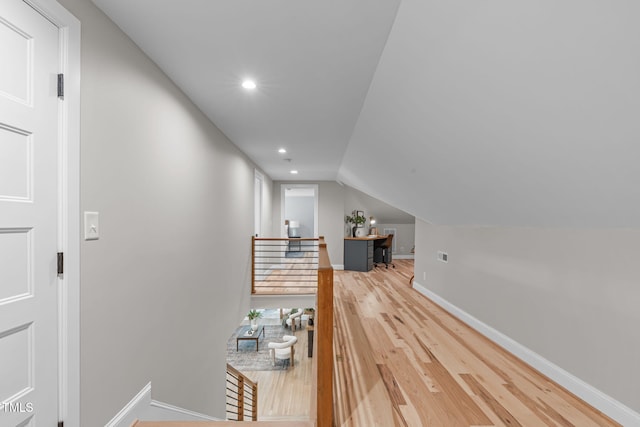 2100 Summit St, Durham, NC 27707 - hall with an upstairs landing, baseboards, wood finished floors, vaulted ceiling, and recessed lighting