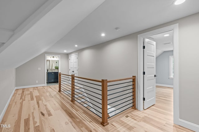 2100 Summit St, Durham, NC 27707 - corridor featuring an upstairs landing, light wood-style floors, baseboards, recessed lighting, and lofted ceiling