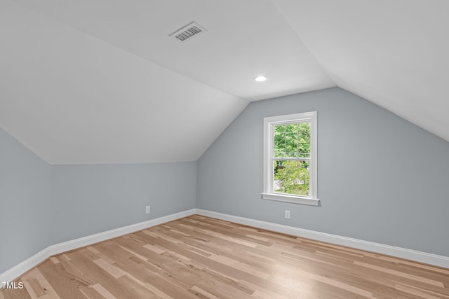 2100 Summit St, Durham, NC 27707 - additional living space featuring baseboards, vaulted ceiling, and light wood-type flooring