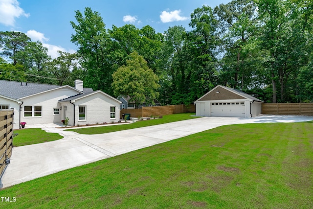 2100 Summit St, Durham, NC 27707 - view of yard featuring a detached garage, an outbuilding, and view of scattered trees