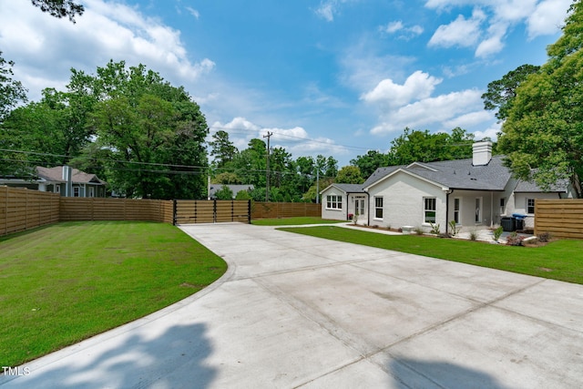 2100 Summit St, Durham, NC 27707 - view of yard featuring driveway and central AC