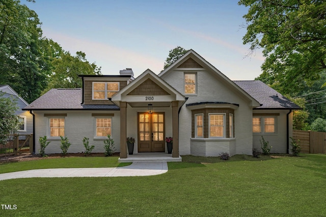 2100 Summit St, Durham, NC 27707 - view of front of house with brick siding, a chimney, and a shingled roof