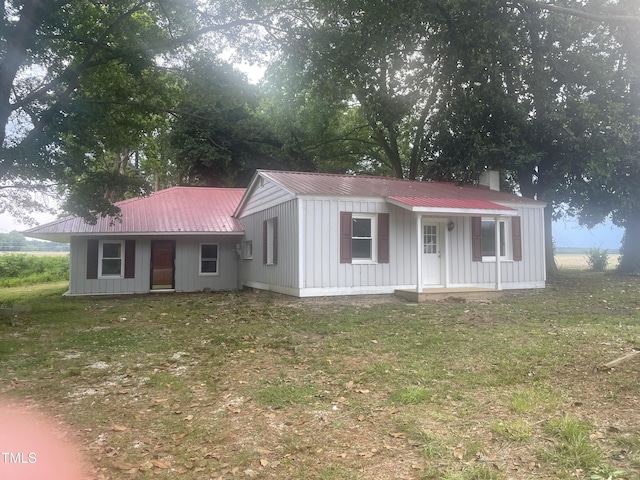 340 Jones Rd, Newton Grove, NC 28366 - ranch-style house featuring metal roof and a front yard