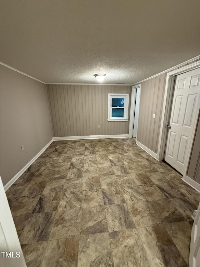 340 Jones Rd, Newton Grove, NC 28366 - spare room with baseboards, a textured ceiling, and crown molding