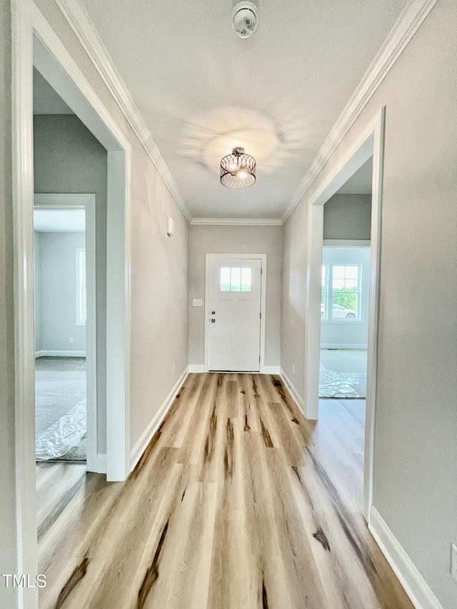 6786 Fire Tower Rd, Bailey, NC 27807 - foyer with light wood-style flooring, baseboards, and ornamental molding