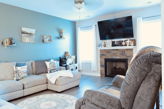 1419 New Daniels Chapel Rd, Fremont, NC 27830 - living area featuring ceiling fan, wood finished floors, a fireplace, and baseboards