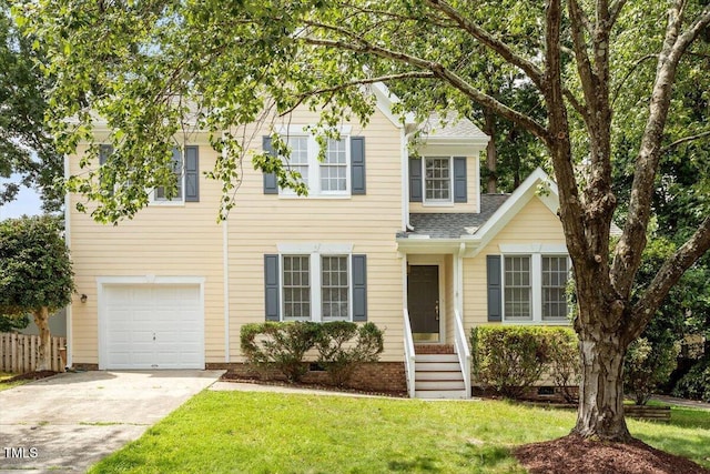 205 Mint Hill Dr, Cary, NC 27519 - view of front of house with driveway, an attached garage, and roof with shingles
