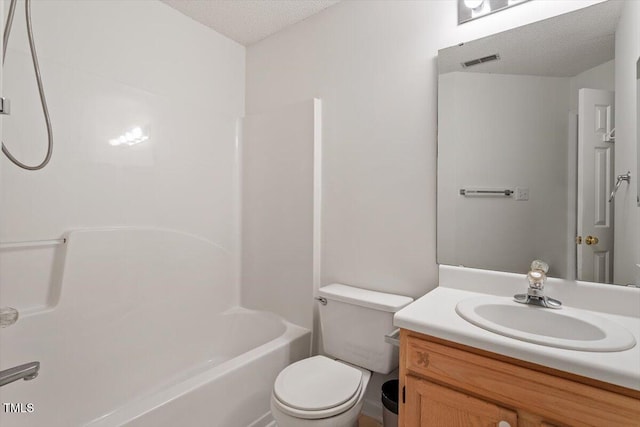 205 Mint Hill Dr, Cary, NC 27519 - bathroom featuring vanity, a textured ceiling, and washtub / shower combination