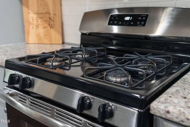 1448 Big Falls Dr, Wendell, NC 27591 - kitchen view of gas range and backsplash