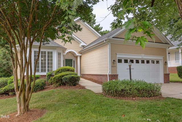 2026 Heritage Pines Dr, Cary, NC 27519 - view of front of house featuring an attached garage, concrete driveway, and a front lawn
