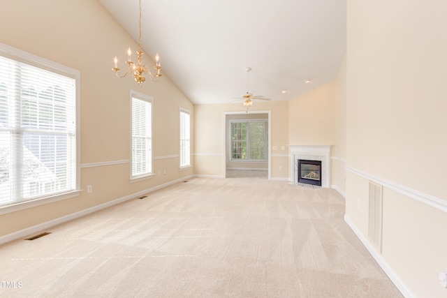 2026 Heritage Pines Dr, Cary, NC 27519 - unfurnished living room featuring vaulted ceiling, a chandelier, a premium fireplace, light colored carpet, and a ceiling fan