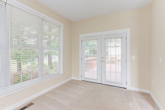 2026 Heritage Pines Dr, Cary, NC 27519 - spare room featuring french doors, carpet floors, and plenty of natural light