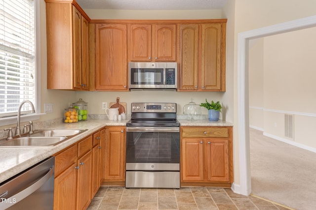 2026 Heritage Pines Dr, Cary, NC 27519 - kitchen featuring stainless steel appliances and light countertops