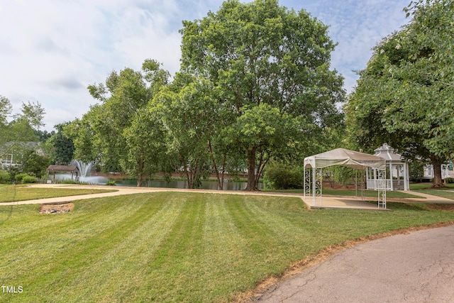 2026 Heritage Pines Dr, Cary, NC 27519 - view of green lawn featuring a gazebo and a water view