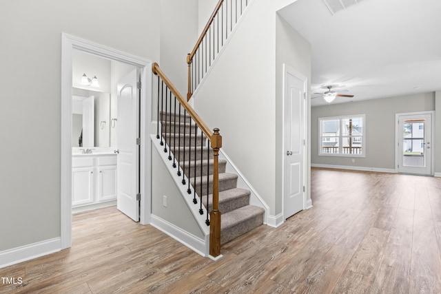 44 Good Morning Ln, Garner, NC 27529 - stairway with wood finished floors, ceiling fan, and baseboards