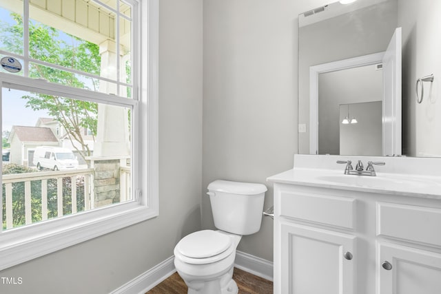 44 Good Morning Ln, Garner, NC 27529 - half bath with toilet, baseboards, vanity, and wood finished floors