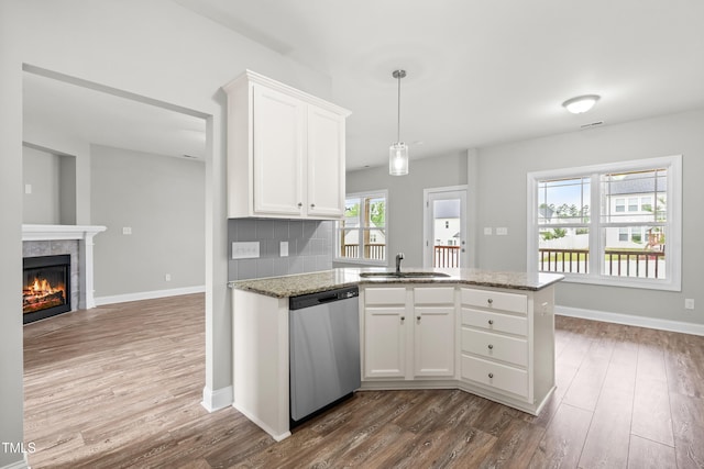 44 Good Morning Ln, Garner, NC 27529 - kitchen with dishwasher, a sink, dark wood-type flooring, and white cabinetry
