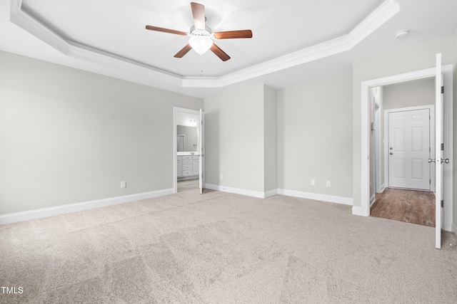 44 Good Morning Ln, Garner, NC 27529 - unfurnished bedroom featuring a raised ceiling, carpet floors, baseboards, ornamental molding, and ensuite bathroom