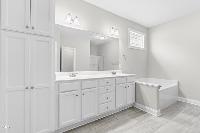 44 Good Morning Ln, Garner, NC 27529 - full bathroom with double vanity, baseboards, an enclosed shower, and a bath