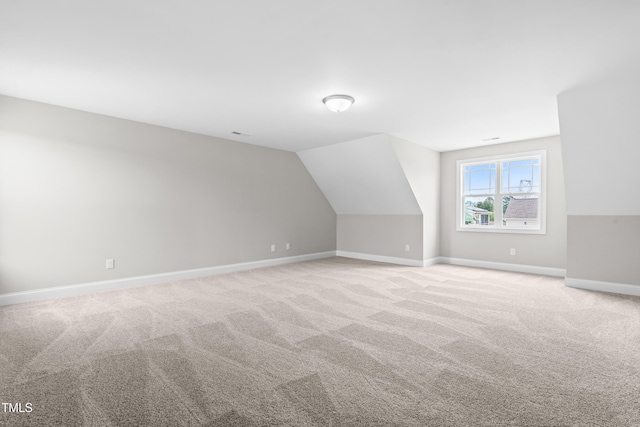 44 Good Morning Ln, Garner, NC 27529 - bonus room featuring baseboards, light colored carpet, and vaulted ceiling