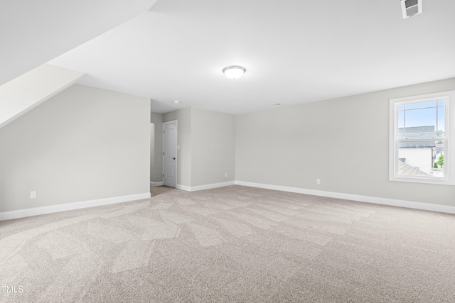 44 Good Morning Ln, Garner, NC 27529 - additional living space with light carpet, baseboards, and vaulted ceiling