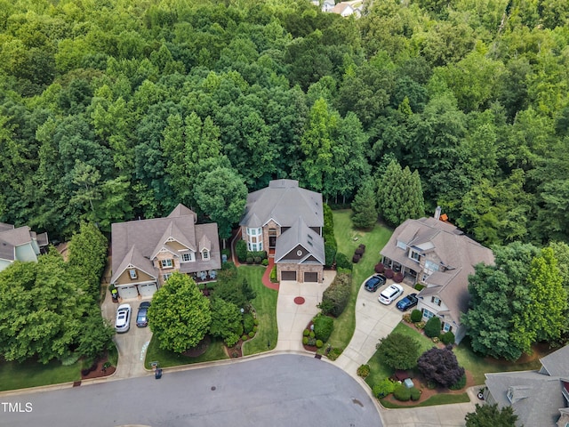 104 Bellagio Dr, Apex, NC 27539 - aerial view of residential area with a heavily wooded area