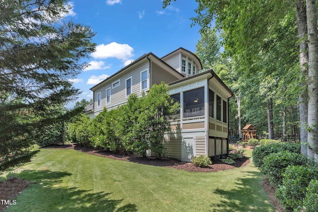 104 Bellagio Dr, Apex, NC 27539 - view of home's exterior with a yard and a sunroom