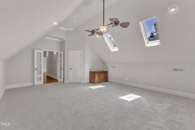104 Bellagio Dr, Apex, NC 27539 - bonus room with lofted ceiling, a skylight, carpet flooring, baseboards, and a ceiling fan