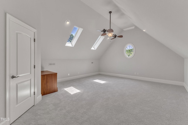 104 Bellagio Dr, Apex, NC 27539 - bonus room featuring a skylight, ceiling fan, lofted ceiling, carpet floors, and baseboards