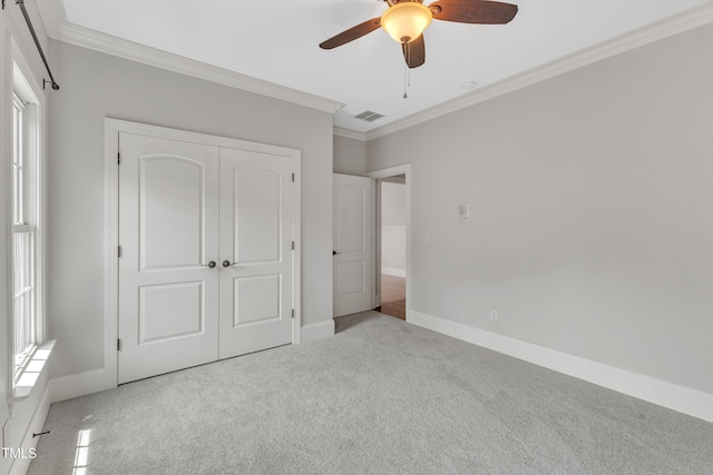 104 Bellagio Dr, Apex, NC 27539 - unfurnished bedroom featuring carpet flooring, ornamental molding, a closet, baseboards, and ceiling fan