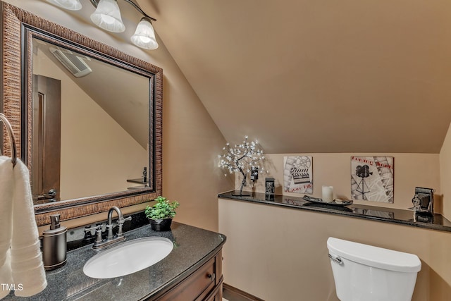 104 Bellagio Dr, Apex, NC 27539 - bathroom featuring lofted ceiling, toilet, and vanity