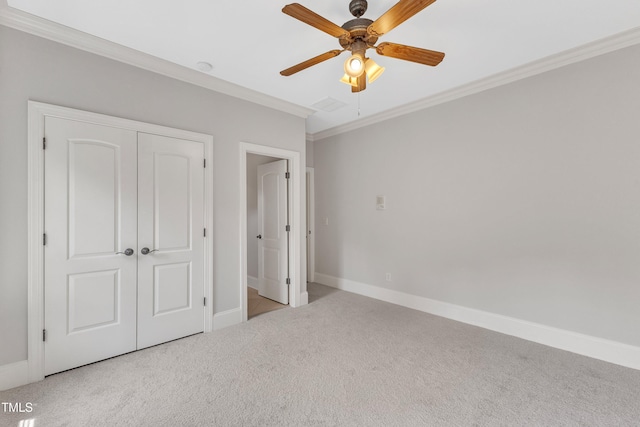 104 Bellagio Dr, Apex, NC 27539 - unfurnished bedroom featuring crown molding, carpet floors, baseboards, a closet, and ceiling fan