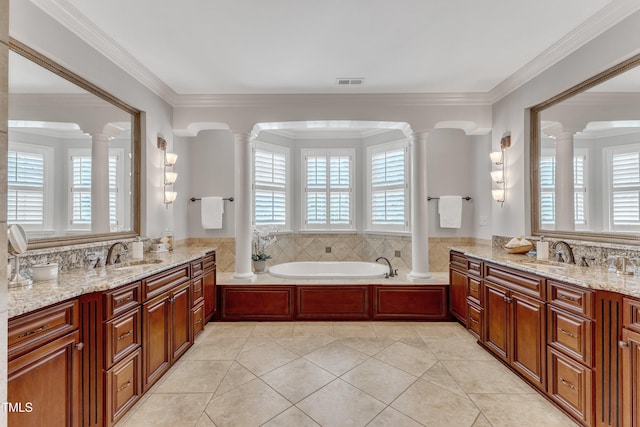 104 Bellagio Dr, Apex, NC 27539 - bathroom with decorative columns, a garden tub, and ornamental molding