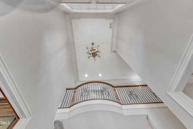 104 Bellagio Dr, Apex, NC 27539 - staircase featuring a chandelier, ornamental molding, and a towering ceiling
