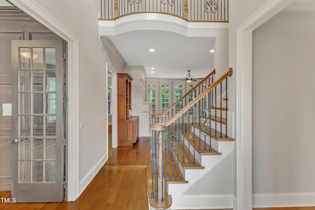 104 Bellagio Dr, Apex, NC 27539 - foyer entrance featuring wood finished floors, baseboards, ceiling fan, recessed lighting, and stairs